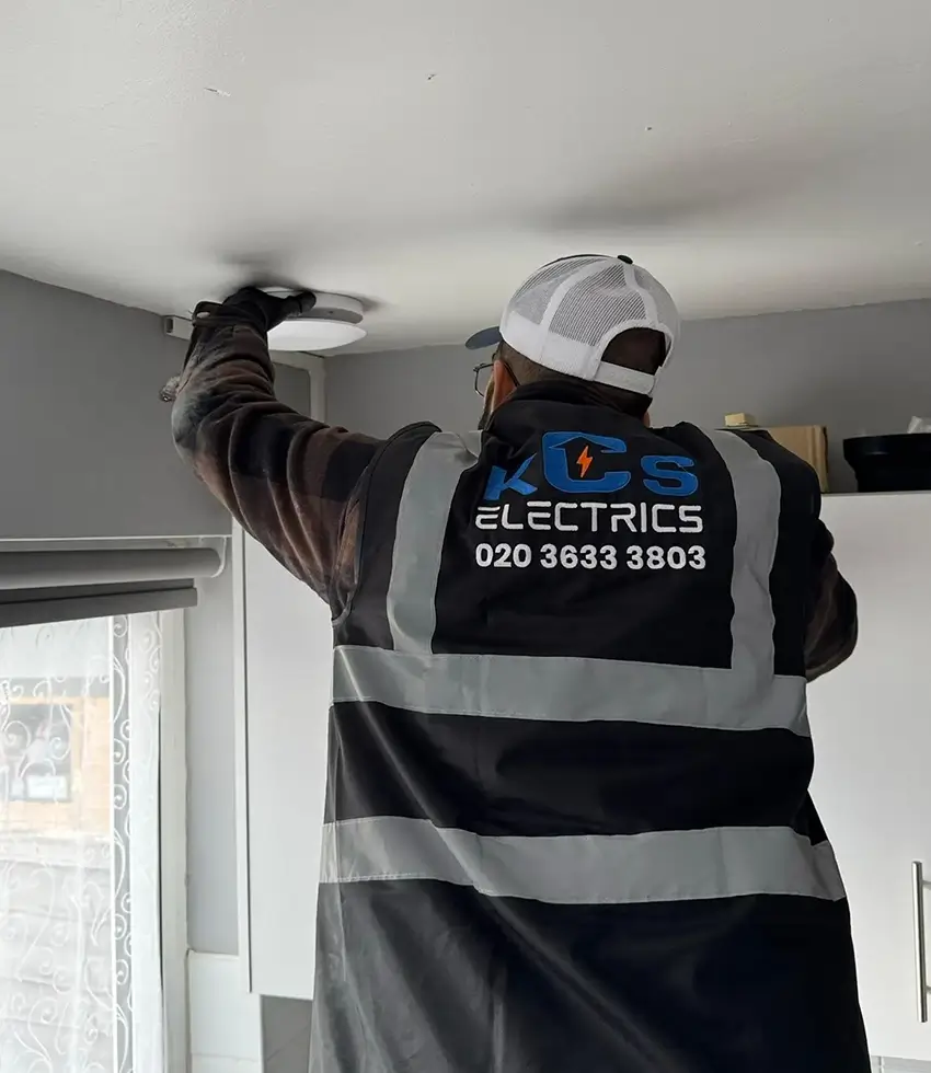 electrician working with indoor extractor fan