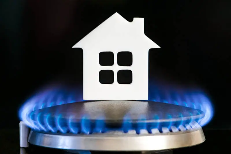 Gas Safe registered engineer testing a boiler in a London rental property